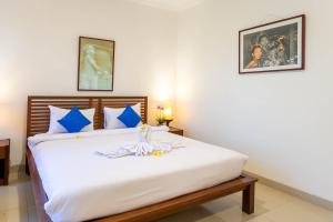 Ein Bett oder Betten in einem Zimmer der Unterkunft Starloka Saba Bali Hotel