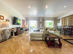 a living room with a couch and a table at Laguna Villa 2 in Hua Hin