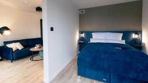 Postel nebo postele na pokoji v ubytování Nena Apartments SPREEblau