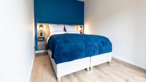 Postel nebo postele na pokoji v ubytování Nena Apartments SPREEblau