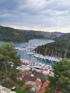 a group of boats docked in a harbor at Malin Guesthouse in Skradin