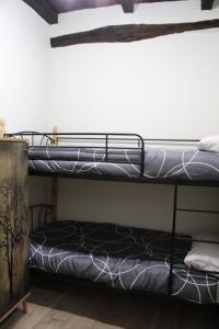 Postel nebo postele na pokoji v ubytování Lua Bierzo
