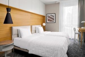 Postel nebo postele na pokoji v ubytování Le Meridien Visconti Rome