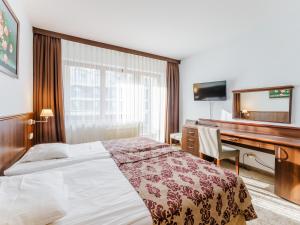 Posteľ alebo postele v izbe v ubytovaní Arka Medical SPA - PRYWATNY APARTAMENT 517A W CZĘŚCI APARTAMENTOWEJ ARKA MEDICAL SPA