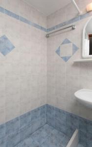 a bathroom with a sink and a shower at "Triacanthos" 2 bedroom house in Moutsoúna +18 photos