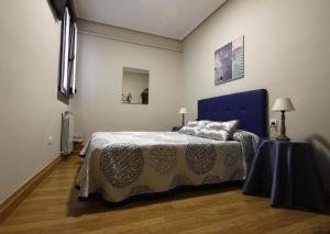 Posteľ alebo postele v izbe v ubytovaní Pension Loinaz