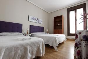Posteľ alebo postele v izbe v ubytovaní Pension Loinaz + 32 fotografií