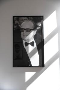 a black and white photo of a man in a tuxedo at Cosmopolita Boutique Hotel in Timişoara