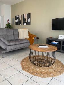 a living room with a couch and a coffee table at The West Apartment in Stella