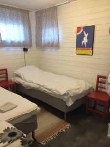Postel nebo postele na pokoji v ubytování Ateljen
