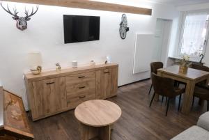 a living room with a tv on a wall at Casa Nenette VDA-AOSTA- n0108 in Aosta