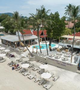 an aerial view of a resort with chairs and umbrellas at Elephant Beach Club & Resort Samui in Chaweng