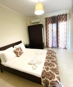 Ένα ή περισσότερα κρεβάτια σε δωμάτιο στο Jasmin Apartments Brown +6 φωτογραφίες