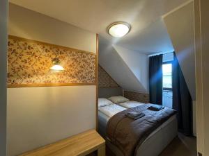 Postel nebo postele na pokoji v ubytování Hotel Veveří