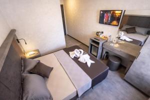 a room with a bed and a table with towels on it at The Queen Hotel in Istanbul +229 photos