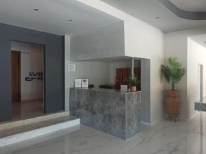 a lobby with a reception desk in a building at Sotirakis Hotel in Faliraki