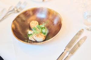 a plate of food on a white table at Domein Martinus in Halle