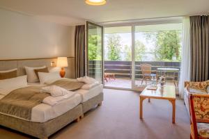 Postel nebo postele na pokoji v ubytování Marina Hotel am Starnberger See