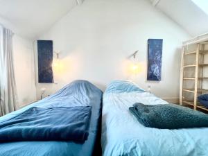 Łóżko lub łóżka w pokoju w obiekcie COC - Villa Saint George