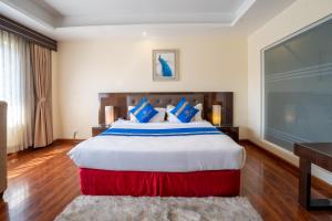 Voodi või voodid majutusasutuse Shangrila Blu Hotel toas