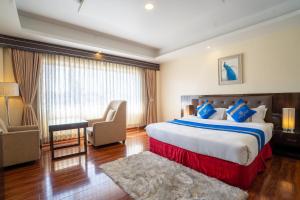 Voodi või voodid majutusasutuse Shangrila Blu Hotel toas