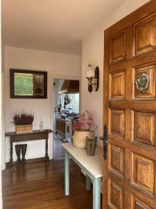 a kitchen with a table and an open door at MAGNIFICA CASA DE CAMPO , CERCA DE LA PLAYA - Villa Quintueles in Cazamular