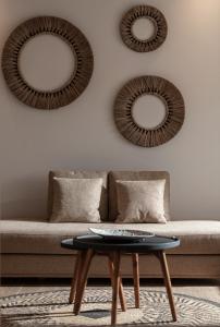a living room with a couch and a table at Antigoni Seaside Resort in Ormos Panagias