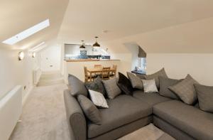 a living room with a couch and a dining room at Stroan in New Galloway