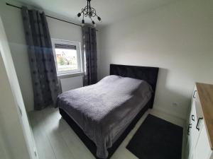 Postelja oz. postelje v sobi nastanitve Apartament Business Sienkiewicza