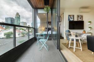 a living room with a view of a city at Walk to the Grand Prix Track 01583 in Melbourne