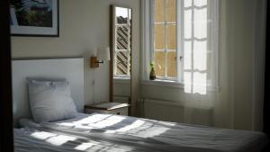 Postel nebo postele na pokoji v ubytování Hotell Hilda