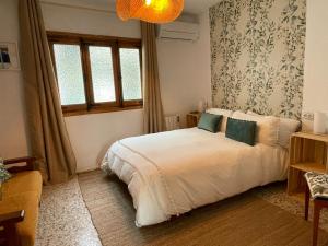 Cama o camas de una habitación en Casa Árbol