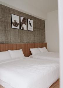 A bed or beds in a room at Huiwei B&B