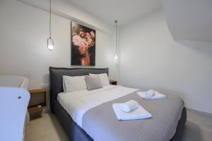 Postel nebo postele na pokoji v ubytování Stone Project Villa
