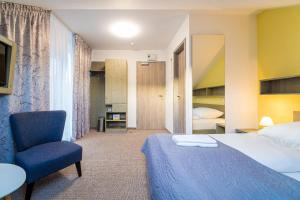 Postel nebo postele na pokoji v ubytování Aparthotel Belveder