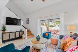 a living room with a couch and a table at The Sanddollar Castle in Saint Augustine