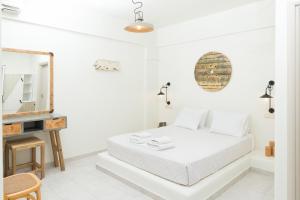 Postel nebo postele na pokoji v ubytování Hotel Sunshine Matala
