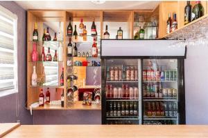 a bar with a lot of bottles of alcohol at High BnBGuestlodge in Johannesburg