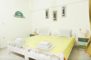 Postel nebo postele na pokoji v ubytování Hotel Sunshine Matala