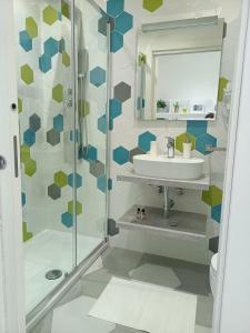 a bathroom with a sink and a shower at Gaeta, B&B la Loggia in Gaeta