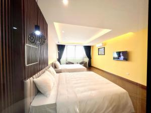 Katil atau katil-katil dalam bilik di An Khang Hotel Sapa