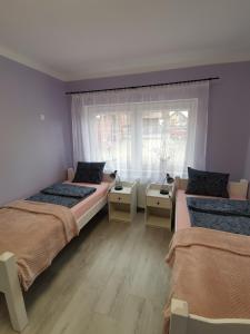 Ένα ή περισσότερα κρεβάτια σε δωμάτιο στο Apartament nad wodą 2