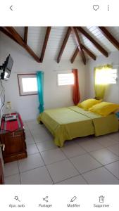 Postel nebo postele na pokoji v ubytování Appartement charmant à Petit-Canal