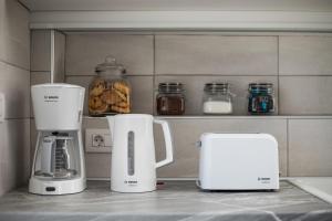 a kitchen with two appliances on a counter at VillaPhysis with Private Pool in Lardos