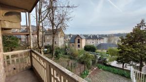 a balcony with a view of a city at Appartement Duplex avec jardin in Rodez