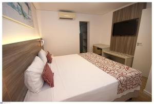 Krevet ili kreveti u jedinici u objektu IT Itabira Hotel