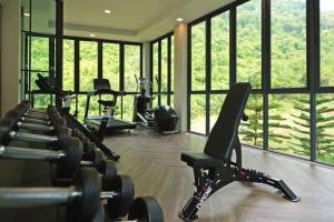 a gym with a bunch of exercise bikes in a room at Execlusive Suite 209 by Forest Khaoyai in Ban Huai Sok Noi