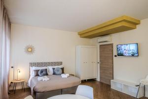 Postel nebo postele na pokoji v ubytování Verona Suites and Rooms
