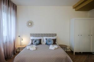 Postel nebo postele na pokoji v ubytování Verona Suites and Rooms