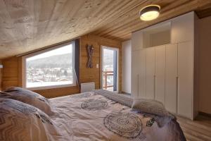 Posteľ alebo postele v izbe v ubytovaní Chalet La Trinité-Spa,Sauna,Pétanque-Gérardmer